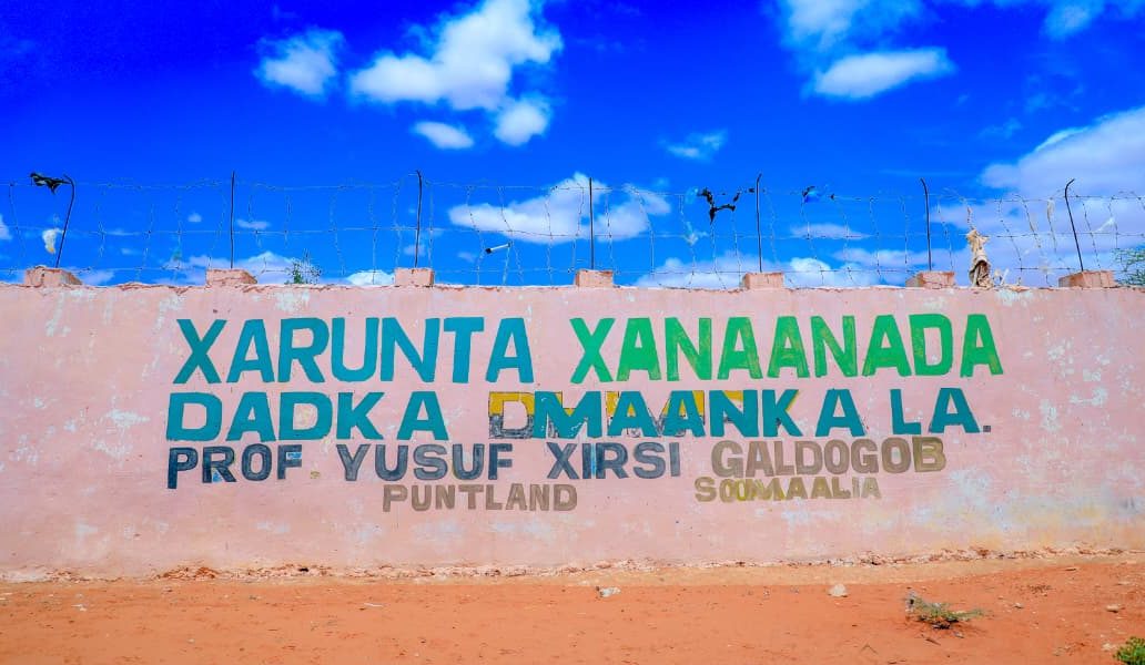 The center's wall naming it after Prof. Yusuf Hersi, Galdogob, Puntland